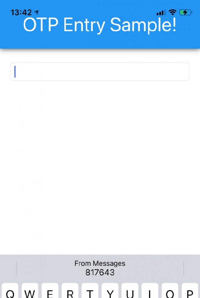 A screenshot of the running Xamarin.Forms sample app. It shows a simple UI with just one entry and you can see the top of the onscreen keyboard at the bottom which suggest a OTP code to fill in the entry on iOS.